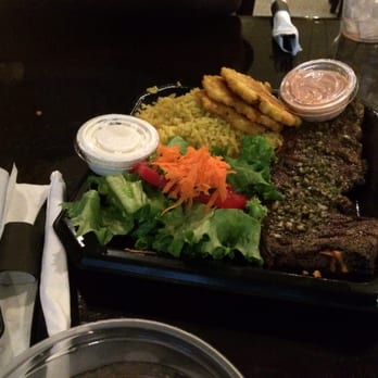 Sofrito Latin Cafe - My boyfriend has the churrasco steak with yellow rice and tostones and a side salad...he said it was really good - Latin American Near Me - Orlando, Florida