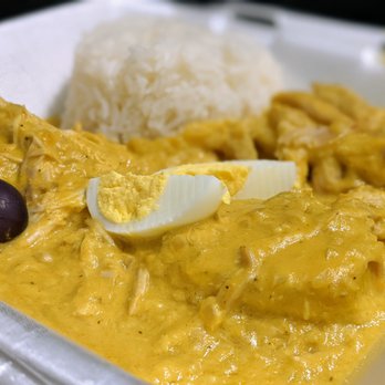 Mi Perú Peruvian Cuisine - Aji de Gallina ($11.99) - pulled chicken breast, creamy aji amarillo sauce; served with sliced potato, sliced boiled eggs, olives, rice. - Peruvian Near Me - Durham, North Carolina