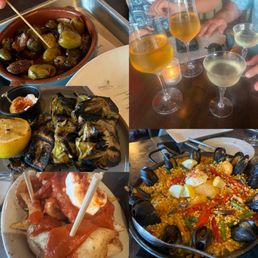 Olives, potatoes, paella, wine, and grilled artichoke. Olives, potatoes, paella, wine, and grilled artichoke.