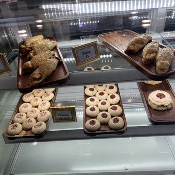 La Amapola Cafe - The pastry case includes quesitos with cream cheese, quesitos de guayaba with guava, and cookies - Bakeries Near Me - St Augustine, Florida