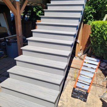 Open Space Design - Azek wrapped stairs and deck with picture frame - Decks & Railing Near Me