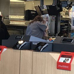 McDonald's - No hairnet or cover.