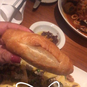DaVinci's - Fresh mini baguette with the sausage filled pasta in the garlic white cream sauce with bacon and peas and mushroom - Italian Near Me - Marco Island, Florida