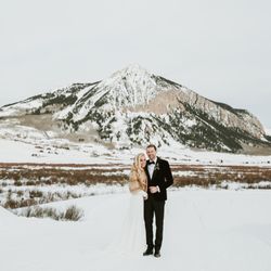 Stargazed Weddings and Events - Bride and groom with mountain background in Crested Butte