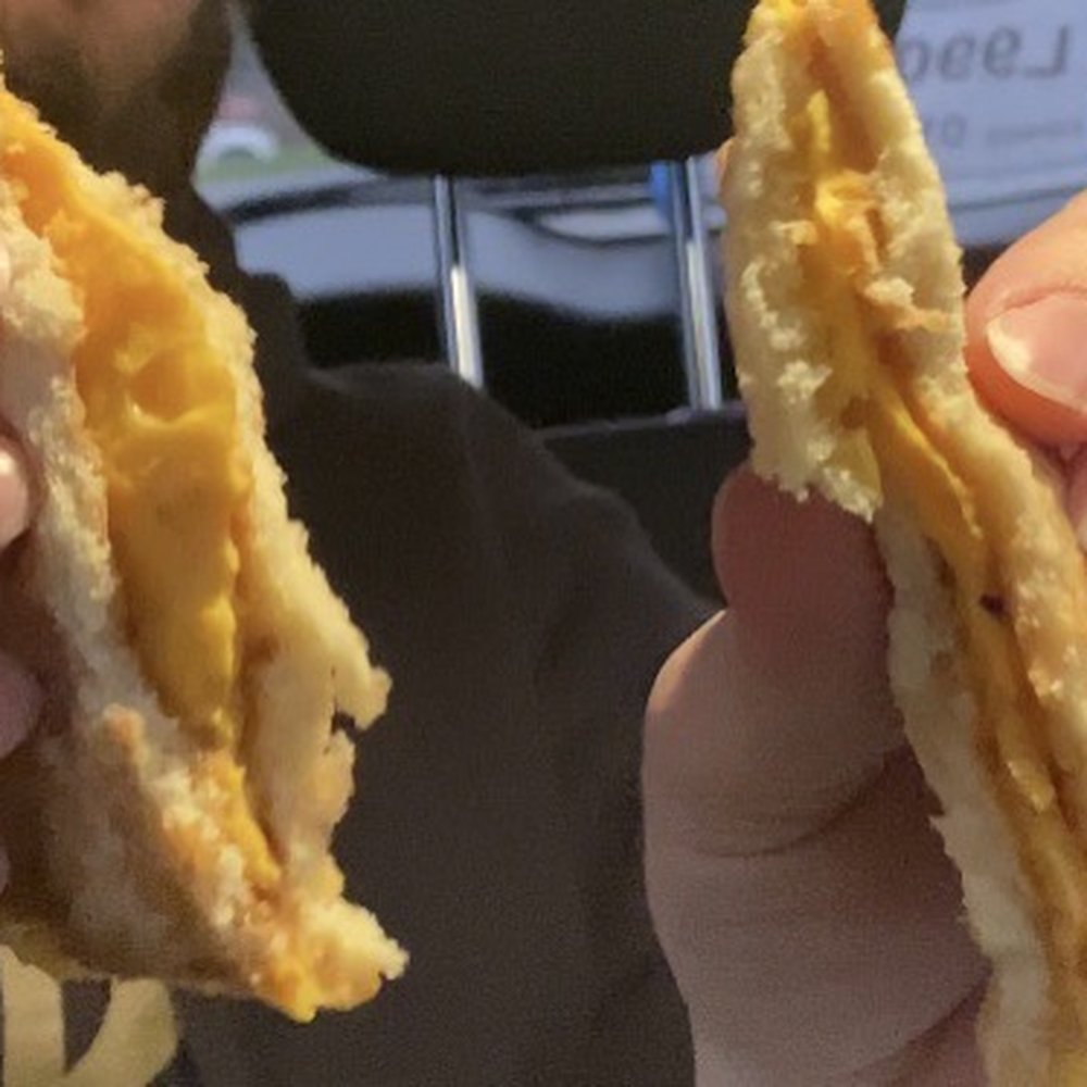 MrBeast Burger - a man holding a half eaten sandwich - Food Delivery Services Near Me MrBeast Burger - a man holding a half eaten sandwich - Food Delivery Services Near Me