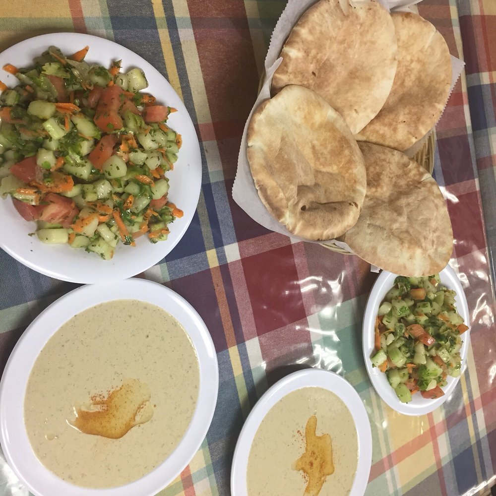 Samakmak Seafood - Salad, pita, and tahini served with our fish platters - Mediterranean Near Me - Jersey City, New Jersey