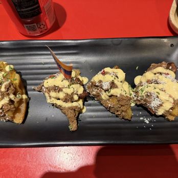 EZ Paella & Tapas - Pulled & ground pork on toast. - Spanish Near Me - New York, New York EZ Paella & Tapas - Pulled & ground pork on toast. - Spanish Near Me - New York, New York