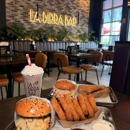Crispy Dubai, Golden Cheeseburger, Corn Ribs, Onion Rings, and Orero Shake Crispy Dubai, Golden Cheeseburger, Corn Ribs, Onion Rings, and Orero Shake
