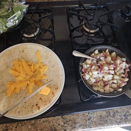 Whittling cheese for a breakfast burrito for hubby, while glamping at Coast Annabelle's.