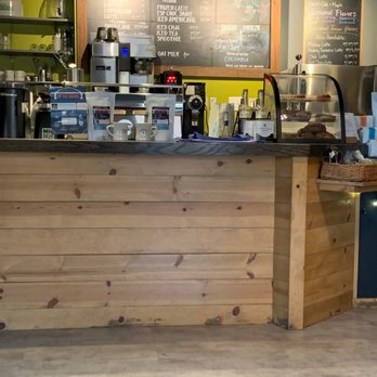 Commonplace Coffee - a coffee shop counter with a menu on the wall - Coffee Roasteries Near Me - Indiana, Pennsylvania Commonplace Coffee - a coffee shop counter with a menu on the wall - Coffee Roasteries Near Me - Indiana, Pennsylvania