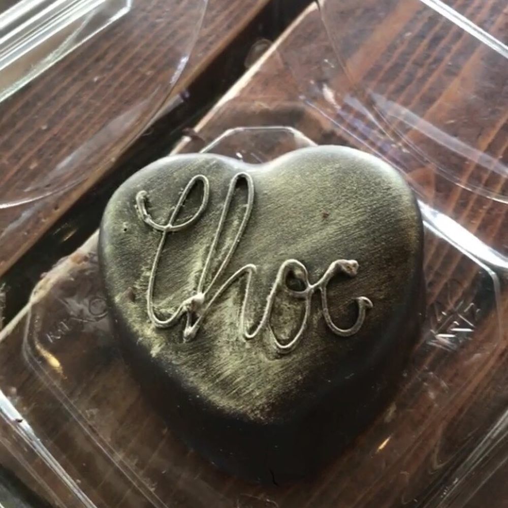 Piece, Love and Chocolate - Chocolate cake with buttercream frosting. - Chocolatiers & Shops Near Me - Boulder, Colorado Piece, Love and Chocolate - Chocolate cake with buttercream frosting. - Chocolatiers & Shops Near Me - Boulder, Colorado