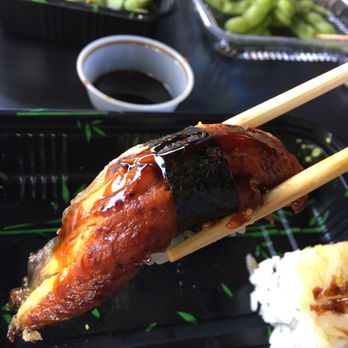 Kiku Asian Bistro - a close up of a chicken with chopsticks - Sushi Bars Near Me - Brooklyn, New York Kiku Asian Bistro - a close up of a chicken with chopsticks - Sushi Bars Near Me - Brooklyn, New York