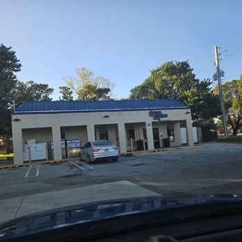 Downstairs - a car parked in front of a building - Gas Stations Near Me - Hollywood, Florida Downstairs - a car parked in front of a building - Gas Stations Near Me - Hollywood, Florida