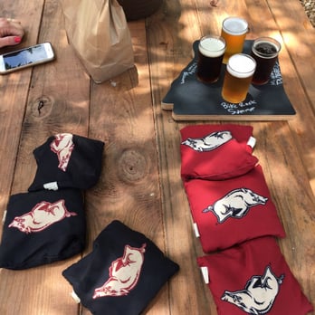 Creekside Taproom - Cornhole and picnic tables outside. - Beer Bar Near Me - Siloam Springs, Arkansas