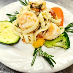 Astoria Park Senior Living - Shrimp fettuccine with herbs and vegetables--a resident favorite from Astoria Park's Best in Senior Living dining program."