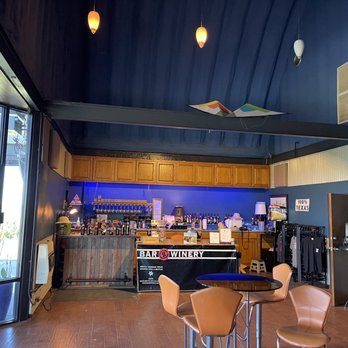 Bar Z Winery - a bar with blue walls and wooden floors - Wineries Near Me - Canyon, Texas