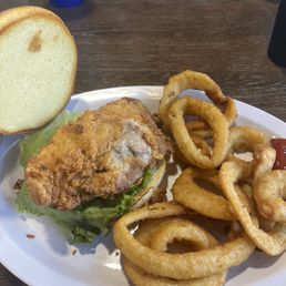 Breaded tenderloin with onion rings. Breaded tenderloin with onion rings.