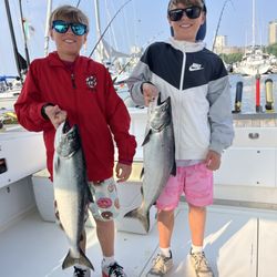Twin brothers with their matching fish!