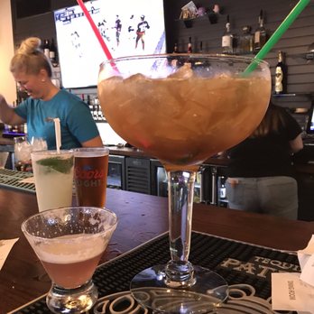 Flipside Burgers and Bar - This is a BIG margarita along side a regular glass for comparison - Burgers Near Me - Milford, Connecticut Flipside Burgers and Bar - This is a BIG margarita along side a regular glass for comparison - Burgers Near Me - Milford, Connecticut