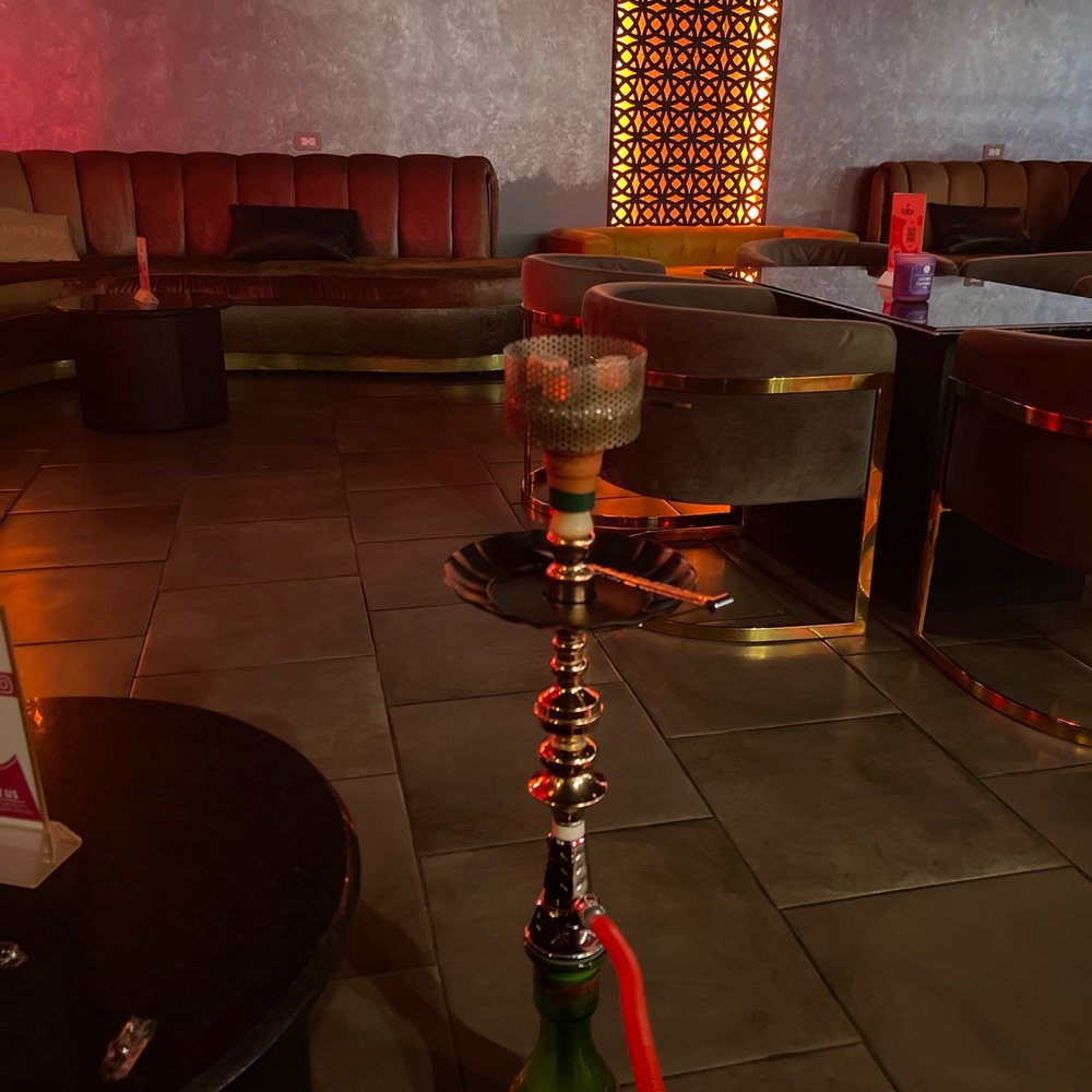 Fusion Bar & Lounge - a hookah with a television in the background - Hookah Bars Near Me - San Diego, California Fusion Bar & Lounge - a hookah with a television in the background - Hookah Bars Near Me - San Diego, California
