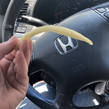 McDonald's - a person holding a piece of food in their hand - Fast Food Near Me - Oklahoma City, Oklahoma McDonald's - a person holding a piece of food in their hand - Fast Food Near Me - Oklahoma City, Oklahoma