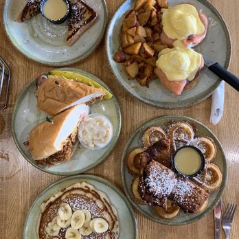 Janik's Cafe - Our spread of a side of french toast and banana pancake, cuban, eggs Benedict, and the chicken n waffles (best by far) - Breakfast & Brunch Near Me - Chicago, Illinois