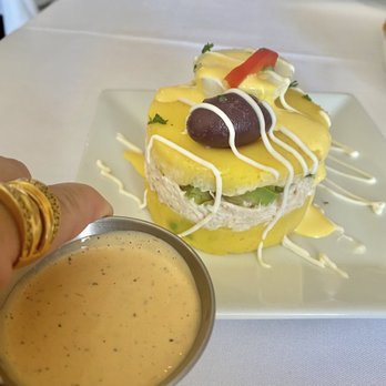 Eli's Peruvian Kitchen - CAUSA RELLANA with added sauce - Peruvian Near Me - San Diego, California Eli's Peruvian Kitchen - CAUSA RELLANA with added sauce - Peruvian Near Me - San Diego, California