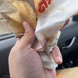 Spicy Nuggets served in a pool of old grease.  (You can see the liquid line of grease in the baggy.)