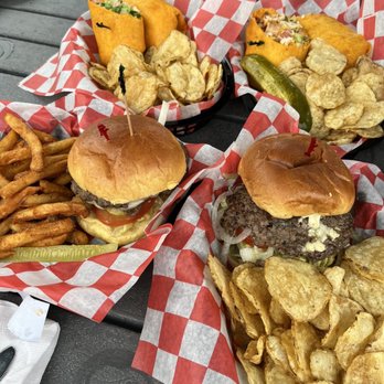 The Lodge - Classic Burger, The Shakedown, The Early Bird (spicy and broasted), and The Blue Star Burger. - American Near Me - South Haven, Michigan