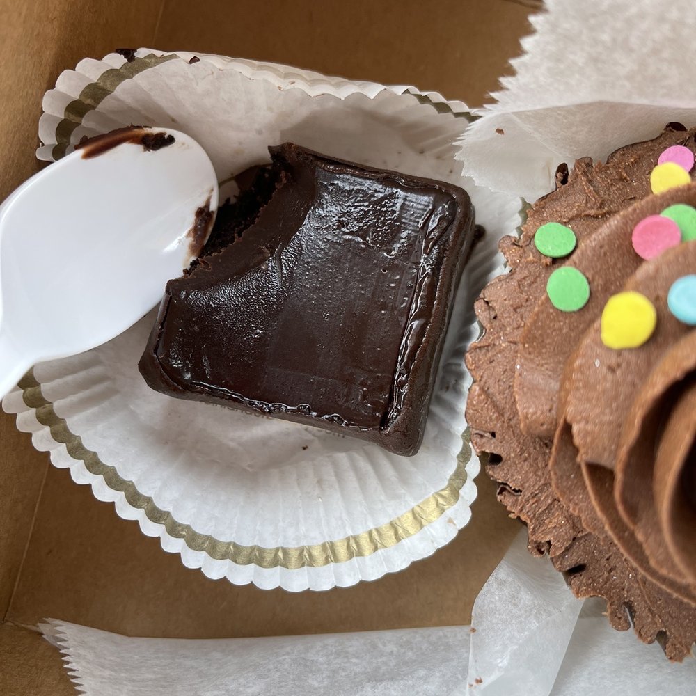 Rheinlander Bakery - Spoon next to Chocolate Truffle Brownie for size reference- $6 for each vegan/GF pastry & cupcake - Bakeries Near Me - Arvada, Colorado Rheinlander Bakery - Spoon next to Chocolate Truffle Brownie for size reference- $6 for each vegan/GF pastry & cupcake - Bakeries Near Me - Arvada, Colorado