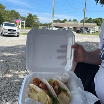 Nana's Main Ingredient - a person holding a box of tacos - Food Trucks Near Me