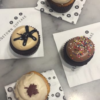 Georgetown Cupcake - clockwise from top: pumpkin spice, chocolate birthday cake, pumpkin cheesecake, and peanut butter fudge - Cupcakes Near Me - Washington, DC, District of Columbia Georgetown Cupcake - clockwise from top: pumpkin spice, chocolate birthday cake, pumpkin cheesecake, and peanut butter fudge - Cupcakes Near Me - Washington, DC, District of Columbia