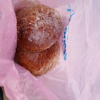 Leonard's Bakery - Each the size of softballs. One original, one coconut puff. Would recommend coconut. - Bakeries Near Me - Honolulu, Hawaii