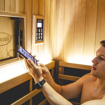 Lumos Infrared Sauna Studio - Lumos Infrared Sauna Studio customer connecting their phone to the sauna audio/speaker system. - Saunas Near Me - Victor, New York Lumos Infrared Sauna Studio - Lumos Infrared Sauna Studio customer connecting their phone to the sauna audio/speaker system. - Saunas Near Me - Victor, New York