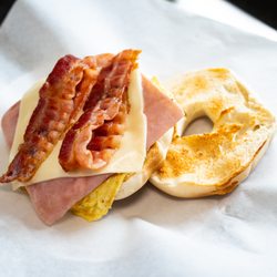 Master’s Donuts 909 - The best selling breakfast croissant - THE ULTIMATE. Available on a bagel or crossiant - egg, bacon, ham, and cheese.