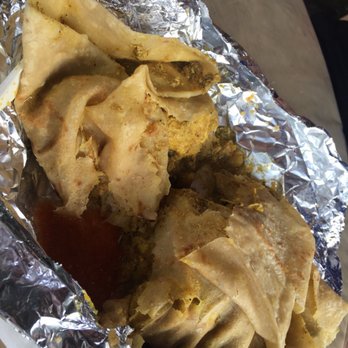 Red Roti Bus - Chicken roti with a little hot sauce on the side - Street Vendors Near Me - Saint Thomas, Virgin Islands Red Roti Bus - Chicken roti with a little hot sauce on the side - Street Vendors Near Me - Saint Thomas, Virgin Islands