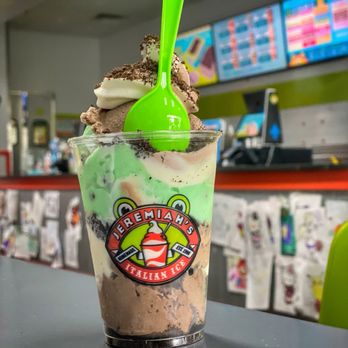 Jeremiah's Italian Ice - The Grasshopper - Scoop Froggy Frog Italian Ice Cookies and Cream Italian Ice  Swirl Soft Ice Cream  Oreo Cookie Crumbles (medium) - Desserts Near Me - Largo, Florida