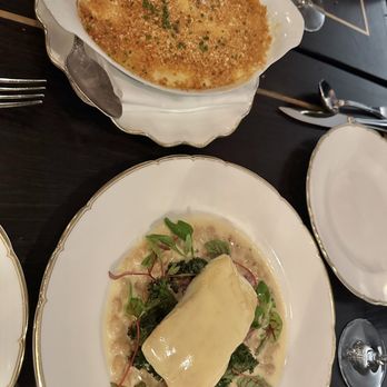 Pasjoli - Gratin dauphinois (delectable scalloped potatoes) and the butter poached halibut - French Near Me - Santa Monica, California Pasjoli - Gratin dauphinois (delectable scalloped potatoes) and the butter poached halibut - French Near Me - Santa Monica, California