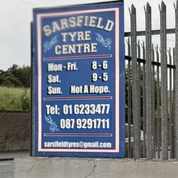 Sarsfield Tyre Centre - Their sign and hours of business