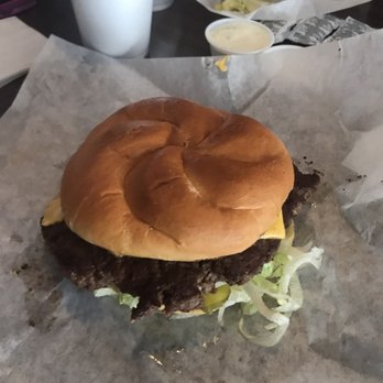 Wildcat's Den - a hamburger on a piece of wax paper - American Near Me - Questa, New Mexico