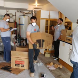 Helpers Disaster Restoration - Team packing out personal contamrs with care
