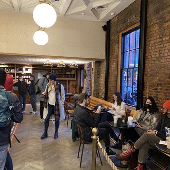Stumptown Coffee Roasters - Seating area, when you first walk in. Beautiful architecture and interior features! - Coffee & Tea Near Me - New York, New York