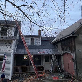 Done Right Construction - a ladder on the roof of a house - General Contractors Near Me