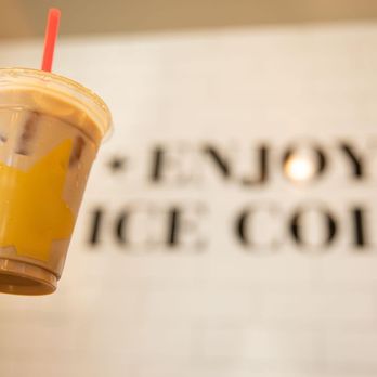 Hardee's - a hand holding a cup of iced coffee - Burgers Near Me - Duncan, South Carolina Hardee's - a hand holding a cup of iced coffee - Burgers Near Me - Duncan, South Carolina