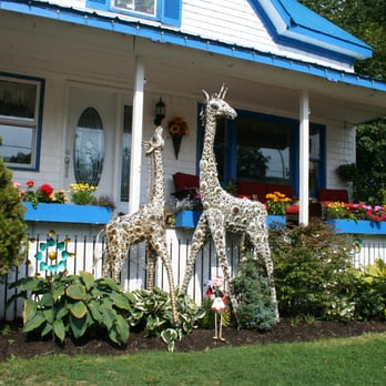 The Toy Factory - Wow... Giant Giraffes in the Toy Factory garden ! Good thing they're friendly ! - Toy Stores Near Me - Queens County, Prince Edward Island