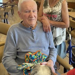 Grace Retirement Community - My dad/ enjoying the therapy dogs.