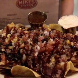 Mike’s Tavern - Beef brisket nachos. Sweet bbq beef on chips.  Lots of food.   Get to share.
