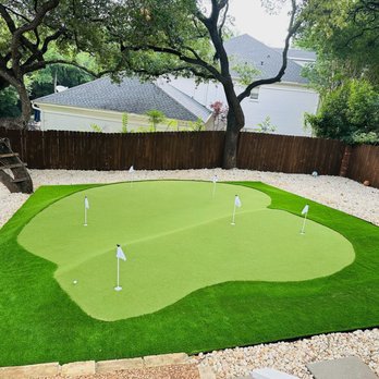 Lone Star Artificial Turf - Six-hole backyard putting green with synthetic fringe and rock border. Custom artificial golf green installed in Austin, Texas - Artificial Turf Near Me - Lakeway, Texas Lone Star Artificial Turf - Six-hole backyard putting green with synthetic fringe and rock border. Custom artificial golf green installed in Austin, Texas - Artificial Turf Near Me - Lakeway, Texas