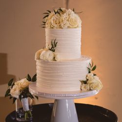 White cake with bavarian cream filling and white buttercream icing (flowers from Delford West)