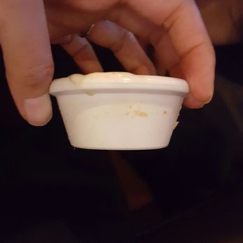 BJ's Restaurant & Brewhouse - Ramekin sitting on my salad - Pizza Near Me - Plano, Texas